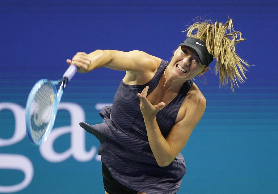 Maria Sharapova of Russia serves against Serena Williams of the United States in a first round match on day one of the 2019 U.S. Open tennis tournament at USTA Billie Jean King National Tennis Center. Photo/Jerry Lai-USA TODAY Sports