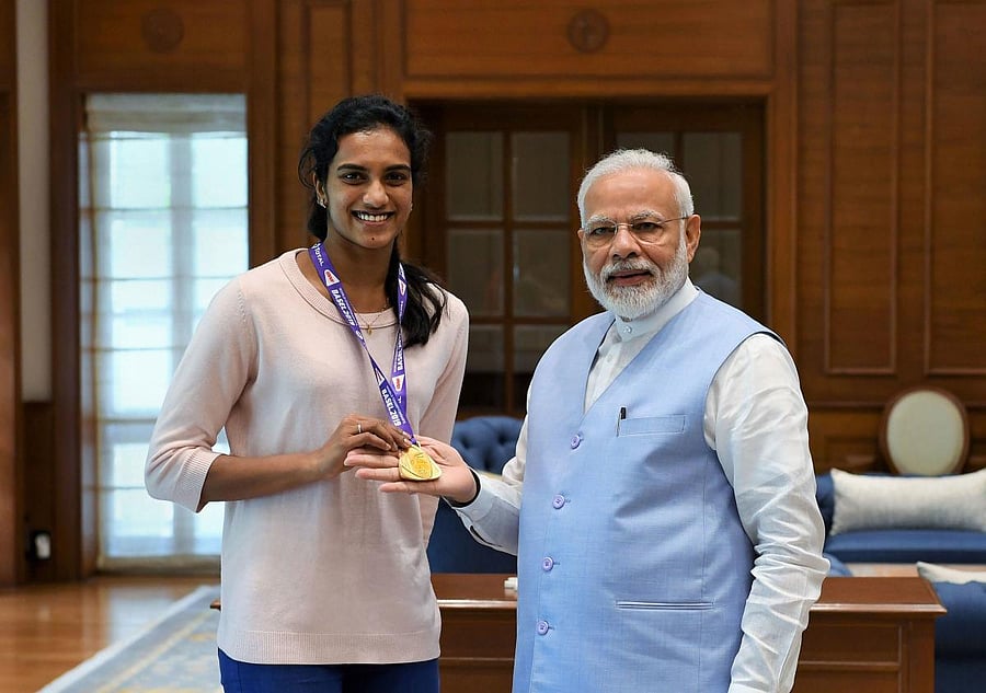 Prime Minister Narendra Modi meets World Champion PV Sindhu in New Delhi. PTI photo