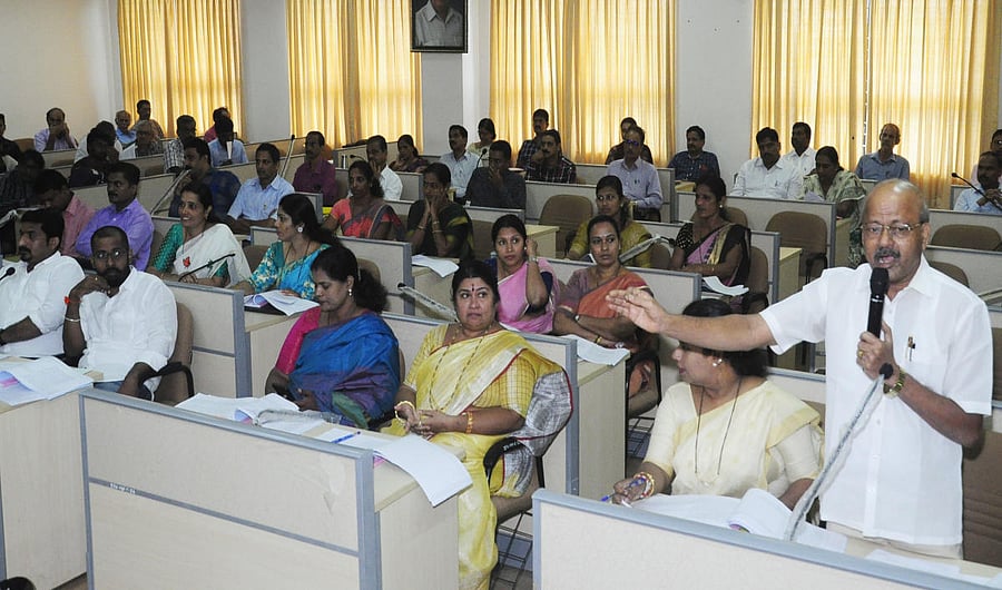 Members take part in a Zilla Panchayat meeting in Manipal on Tuesday. 