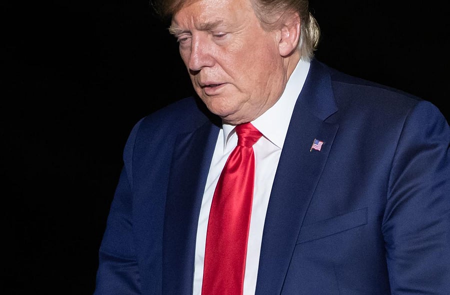 US President Donald Trump walks from Marine One upon arrival on the South Lawn of the White House in Washington, DC, August 26, 2019, following their trip to the G7 Summit in France. (Photo by SAUL LOEB / AFP)