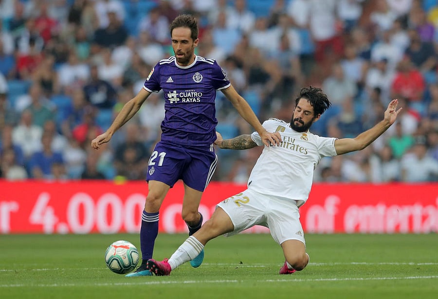 Real Valladolid's Michel in action with Real Madrid's Isco. (Reuters Photo)