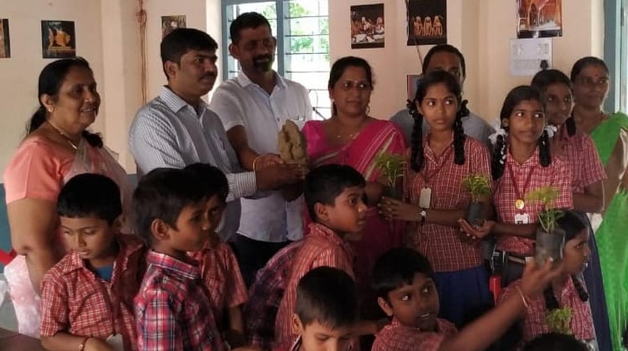 Members of Eco Friends Group distributed clay Ganesha idols and saplings to the schoolchildren of Zilla Panchayat Higher Primary School at Kadri.