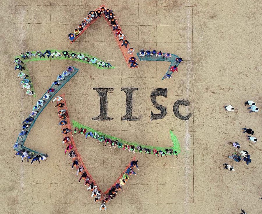 Aerial view of a human formation of the new logo. 