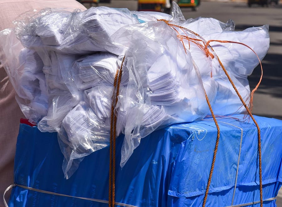 A man loaded plastic covers on the two wheller, even BBMP ban the plastic at Hudson Circle near Halasuru Gate Police Station in Bengaluru on Sunday. Photo by S K Dinesh