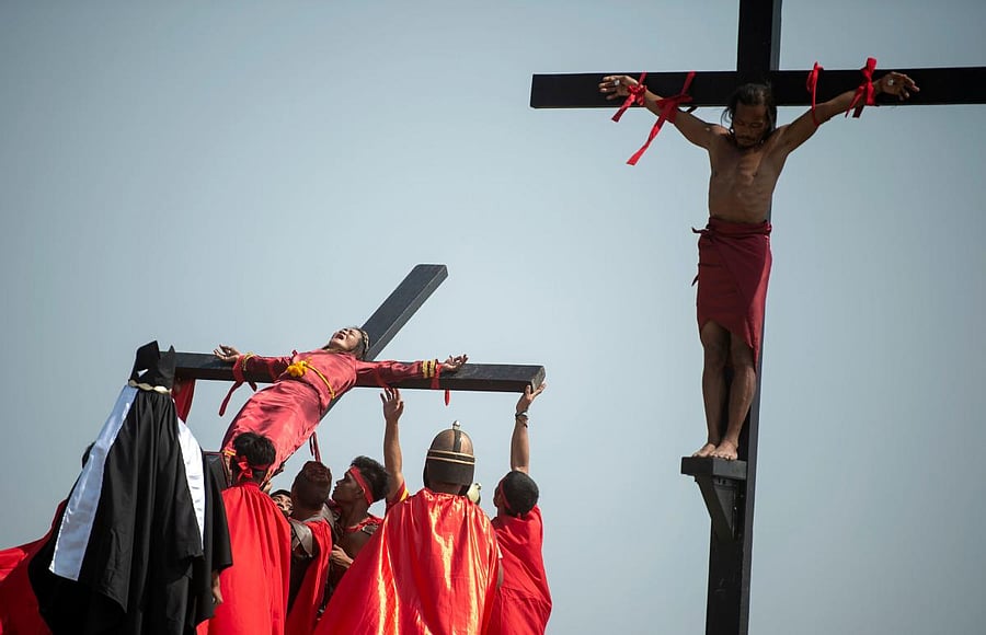 Philippine Christian devotees are nailed to crosses during a reenactment of the Crucifixion of Christ during Good Friday ahead of Easter in the village of Cutud near San Fernando. (AFP File Photo)