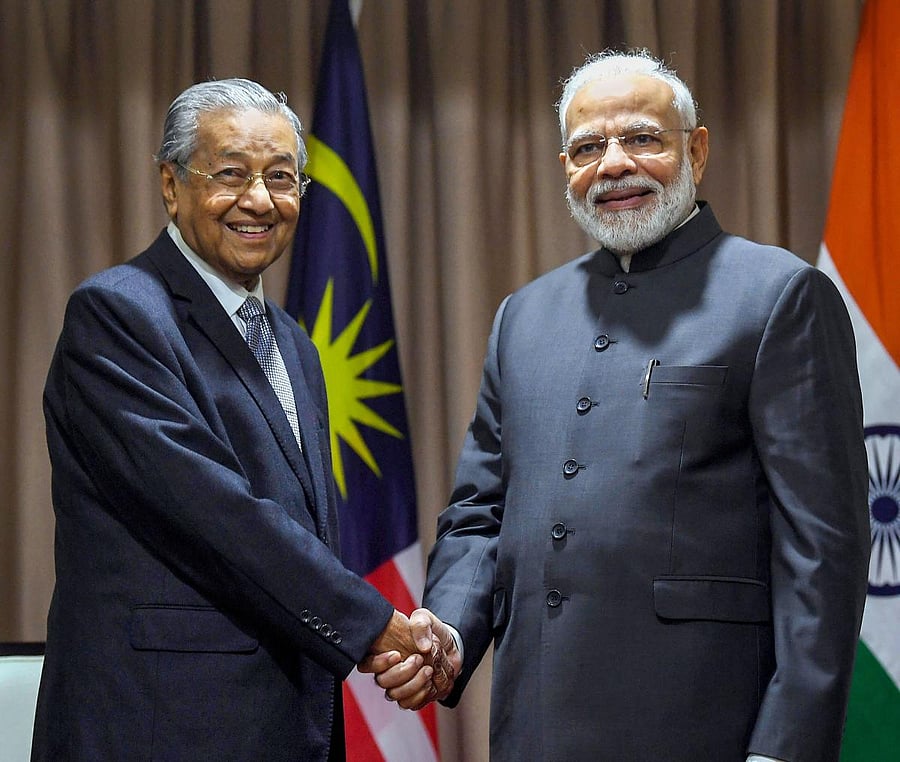 Prime Minister Narendra Modi shakes hands with his Malaysian counterpart Mahathir Mohamad, on the sidelines of 5th Eastern Economic Forum, at Vladivostok, in Russia, on September 5, 2019. PIB/PTI
