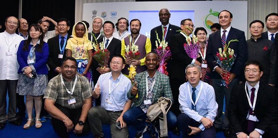 Union Minister Prakash Javadekar in a group photograph with the Administrator of National Forestry &amp; Grassland Administration, China, Zhang Jianlong, at the 14th Conference of Parties COP 14 United Nations Convention to Combat Desertification, at Indi