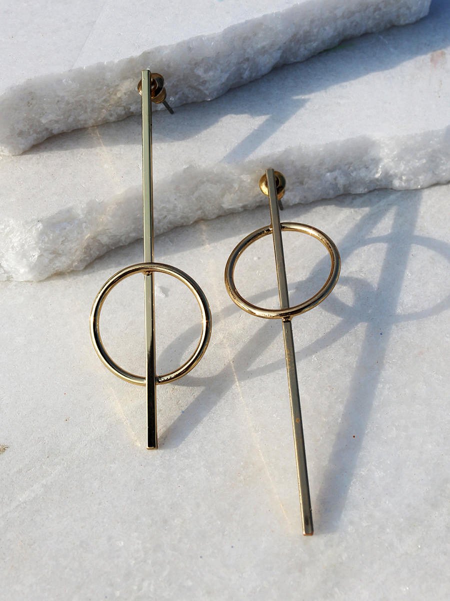 Buy a pair of contemporary earrings to upgrade your white shirt and jeans style.