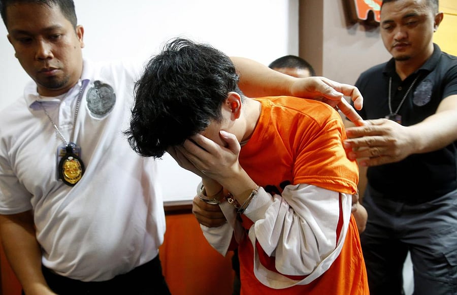 The Bureau of Immigration late Tuesday said 324 Chinese nationals were arrested in Puerto Princesa City on Palawan island during Monday's operation. (AP/PTI Photo)