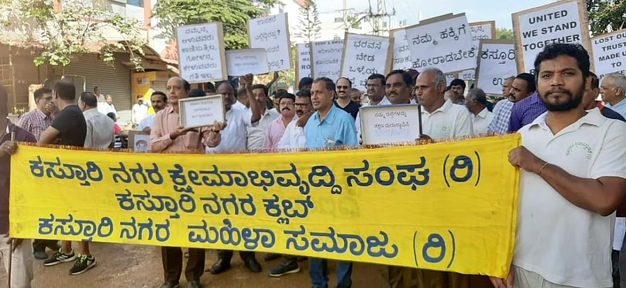 Kasturinagar residents protest for good roads on Monday. SPECIAL ARRANGEMENT