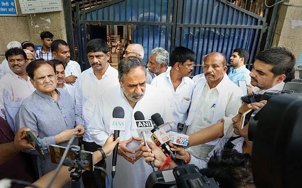 Congress leader Anand Sharma addresses the media as Ahmed Patel looks on after meeting Karnataka Congress leader DK Shivakumar at Tihar jail. (Photo/PTI)