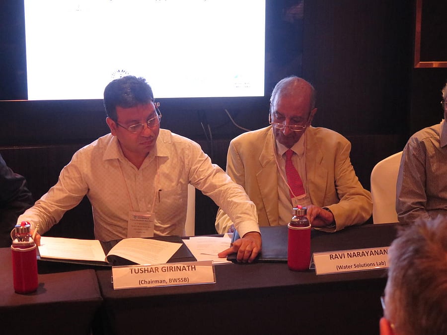 BWSSB Chairman Tushar Giri Nath (left) and Dr Ravi Narayanan of the Water Solutions Lab sign an MoU, in which the Lab would offer significant technical and financial support to the Board to assess and create sustainable water management solutions in the c