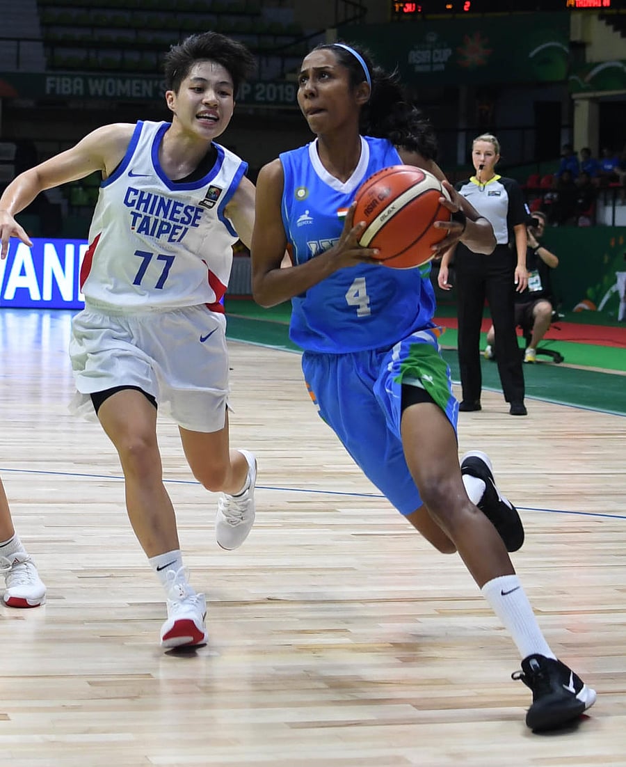 India’s Anjana (right) attempts to move past a Chinese Taipei defender during their Group A clash on Thursday. DH PHOTO/ BH SHIVAKUMAR