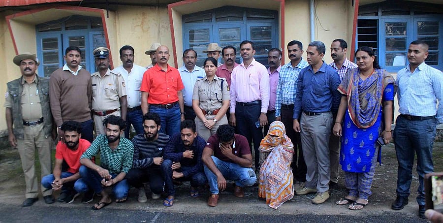 Police personnel with the accused.