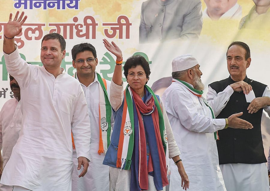 Congress leader Rahul Gandhi waves at his supporters during a campaign rally in support of party candidate Aftab Ahmed ahead of Haryana Assembly polls, in Nuh district of Haryana. PTI
