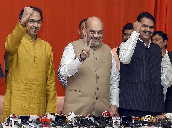 Shiv Sena chief Uddhav Thackeray, BJP leader Amit Shah and Maharashtra Chief Minister Devendra Fadnavis. (PTI photo)