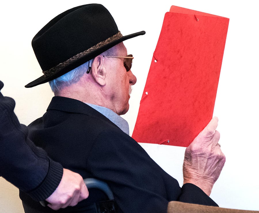 The 93-year-old German Bruno D. arrives for his trial in Hamburg court, Germany, October 17, 2019, accused of being an SS guard and involved in killings between August 1944 and April 1945, helping to murder thousands of prisoners, many of them Jewish, in the Stutthof Nazi concentration camp near Gdansk, Poland. Daniel Bockwoldt/Pool via REUTERS