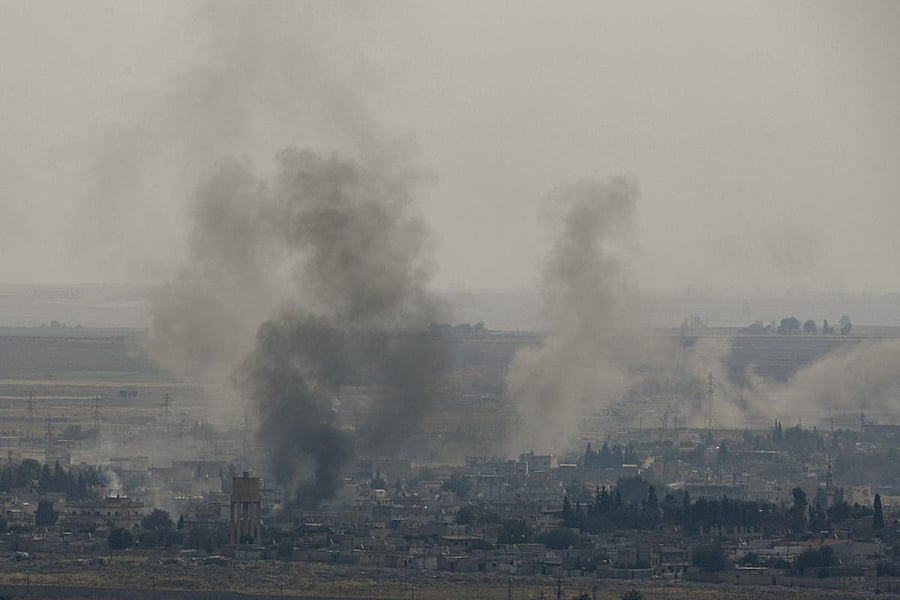 Smoke rising from the Syrian town of Ras al-Ain during the Turkish offensive against Kurdish groups in northeastern Syria. AFP Photo