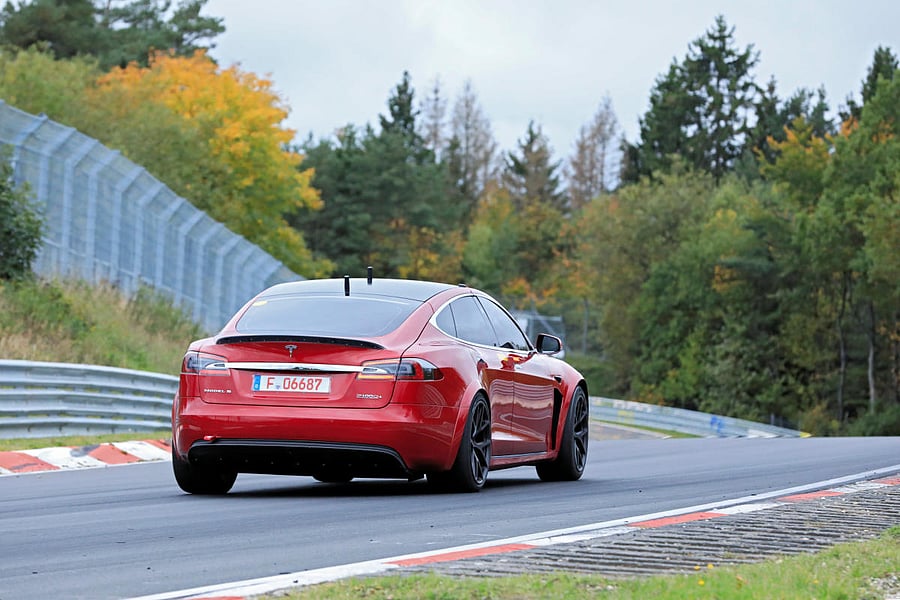 A driver steers a Tesla Model S at the Nuerburgring race track, in the western German low mountain range of the Eifel near Adenau, Germany October 15, 2019. REUTERS/Stefan Baldauf 