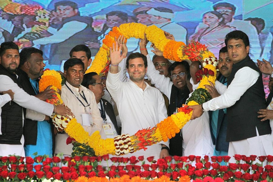 Kalahandi: Congress President Rahul Gandhi being garlanded during a public meeting 'Parivartan Sanklap Samavesh' at Bhawanipatna, in Kalahandi district of Odisha, Wednesday, Feb. 6, 2019. (PTI Photo) (PTI2_6_2019_000130B)