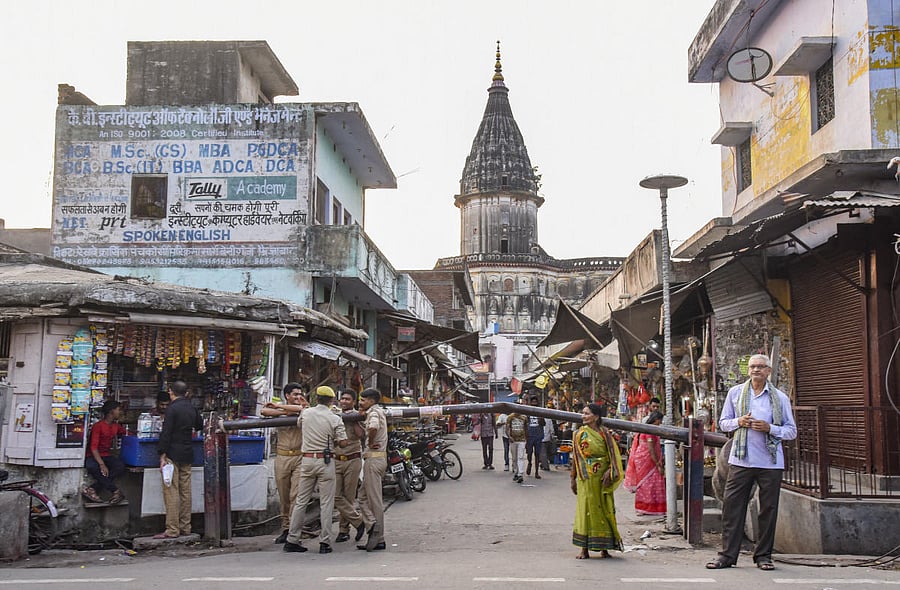 Policemen at the check point of Hanumangarhi Chauraha in the temple city of Ayodhya, Thursday evening. (PTI Photo)
