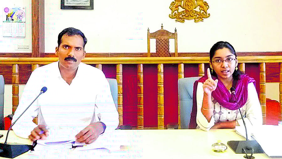 Zilla Panchayat CEO K Lakshmi Priya speaks during the meeting of election nodal officers at the DC's office hall on Monday. Kodagu Additional Deputy Commissioner T Yogesh looks on.