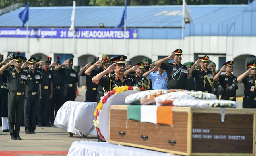 Vice-Chief of Army Staff Gen. M M Naravane along with Indian Army personnel pay tributes to martyrs Hawaldar Padam Bahadur Shrestha (Assam) & Rifleman Gamil Kumar Shrestha at Palam Delhi Tech Area in New Delhi on Monday. (PTI Photo)