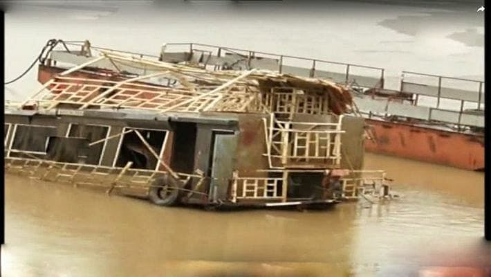 The Royal Vasishta boat after it surfaced and TV grab of Dharmadi Satyam speaking with media.