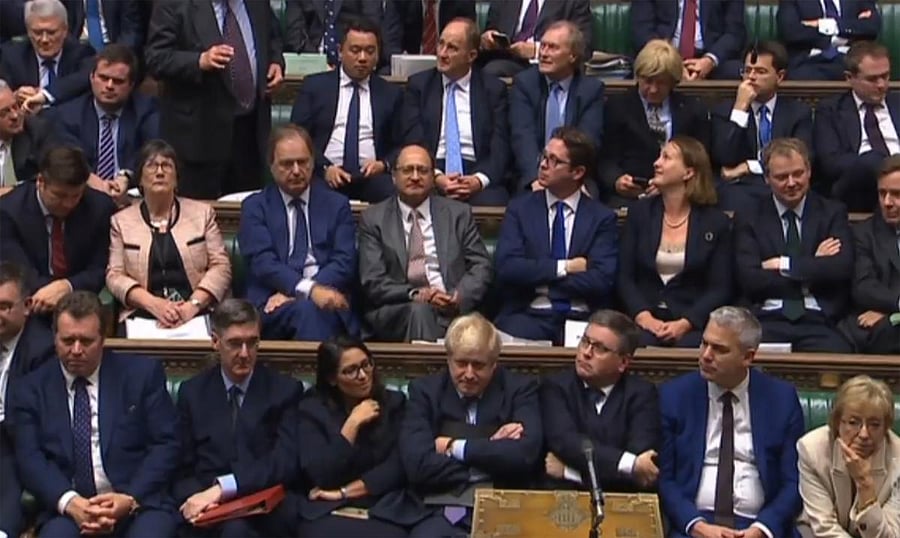 A video grab from footage broadcast by the UK Parliament's Parliamentary Recording Unit (PRU) shows Britain's Prime Minister Boris Johnson (bottom C) reacts after the programme motion setting out the proposed timetable for the Brexit withdrawal Agreement