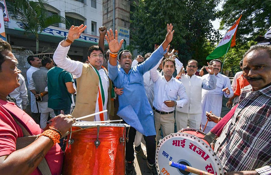 Congress workers celebrate party candidate Kantilal Bhuria's victory in Jhabua Assembly by-election, at the party office in Bhopal, Thursday, Oct. 24, 2019. (PTI Photo)