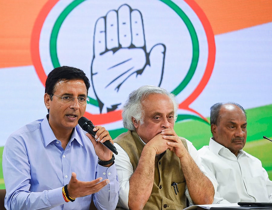 Senior Congress leaders Randeep S Surjewala, Jairam Ramesh and AK Anthony during a press conference at AICC HQ in New Delhi. (PTI Photo)