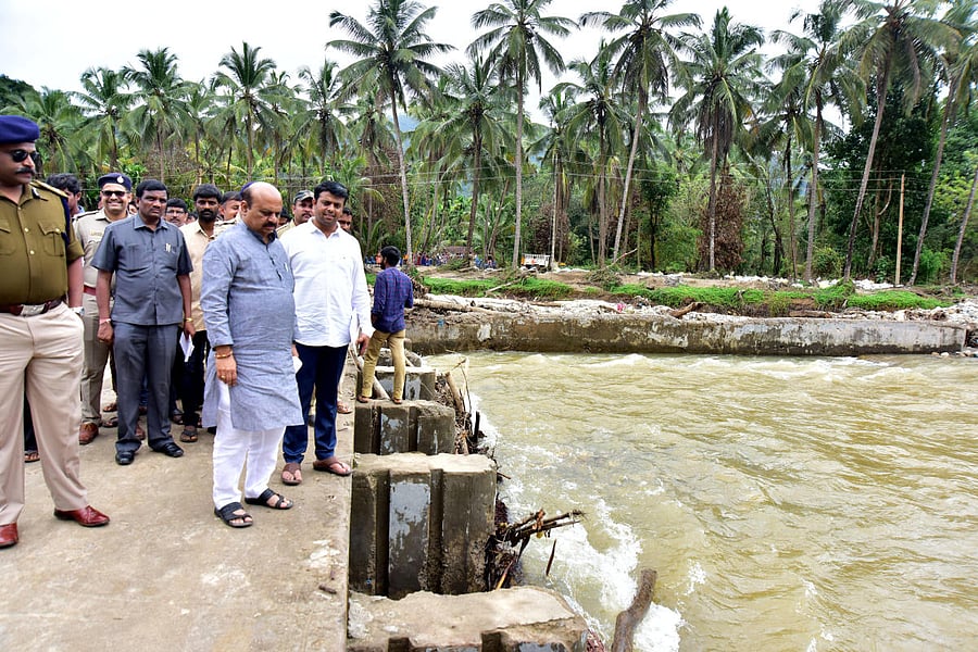 Home Minister Basavaraj Bommai inspects flood-hit areas in Aranepade in Belthangady taluk on Thursday.