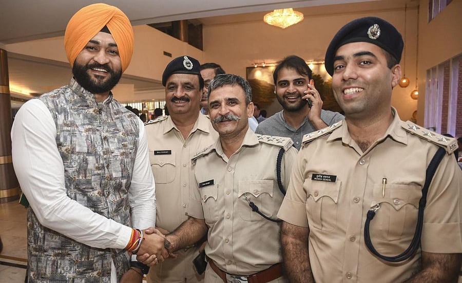 Former hockey captain and newly-elected BJP MLA meets police officials in Chandigarh, Saturday, Oct. 26, 2019. (PTI Photo)