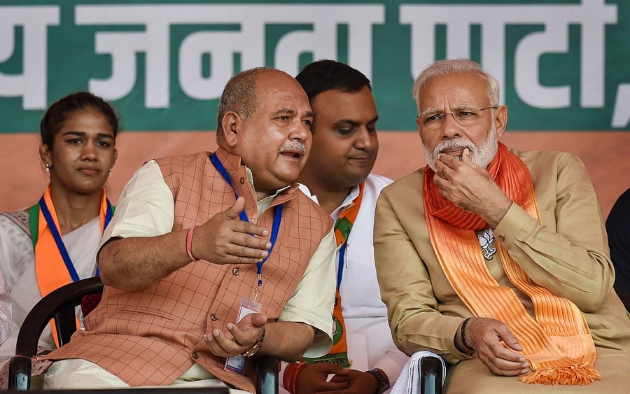 Prime Minister Narendra Modi with Union Minister and Narendra Singh Tomar. PTI Photo