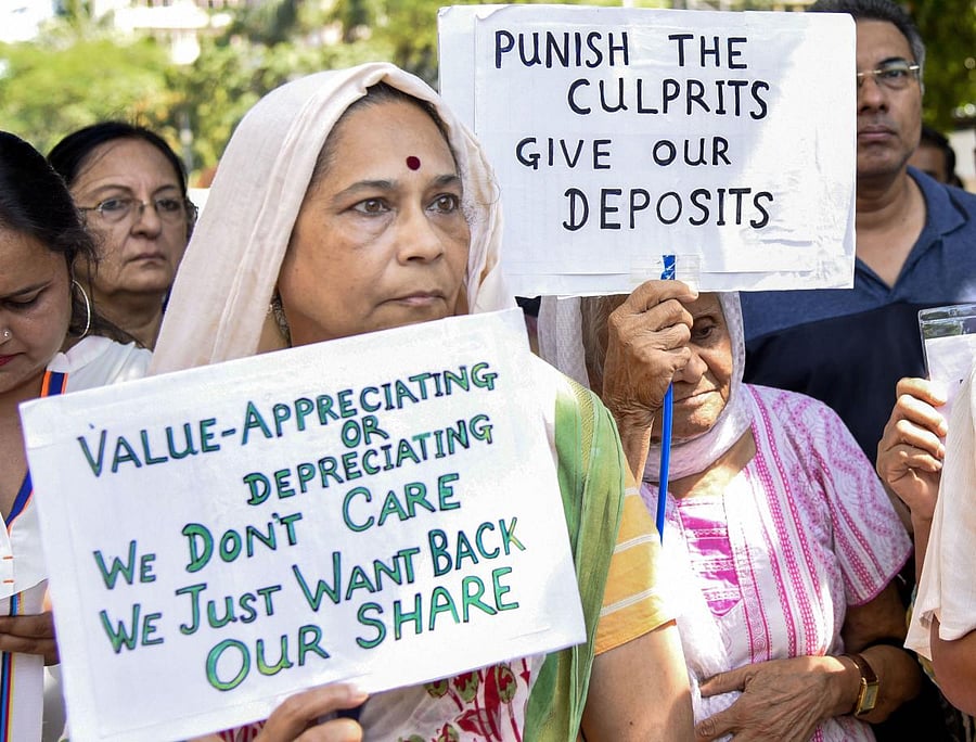 Depositors of PMC Bank protest outside the Reserve Bank of India, at BKC in Mumbai, Tuesday, Oct. 29, 2019. (PTI Photo)