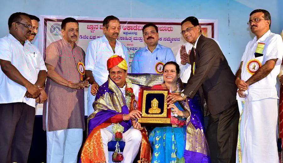Fifth Vachana Sahitya Sammelana President and Senior Chartered Accountant S S Nayak and his wife were felicitated during the fifth Vishwa Kannada Vachana Sahitya Hagu Samskrithika Sammelana 2019 and Kannada Rajyotsava Sambhrama at Ravindra Kala Bhavana in University College premises, Hampankatta, Mangaluru on Sunday. New Mangalore Port Trust Chairman A V Ramana and others look on.