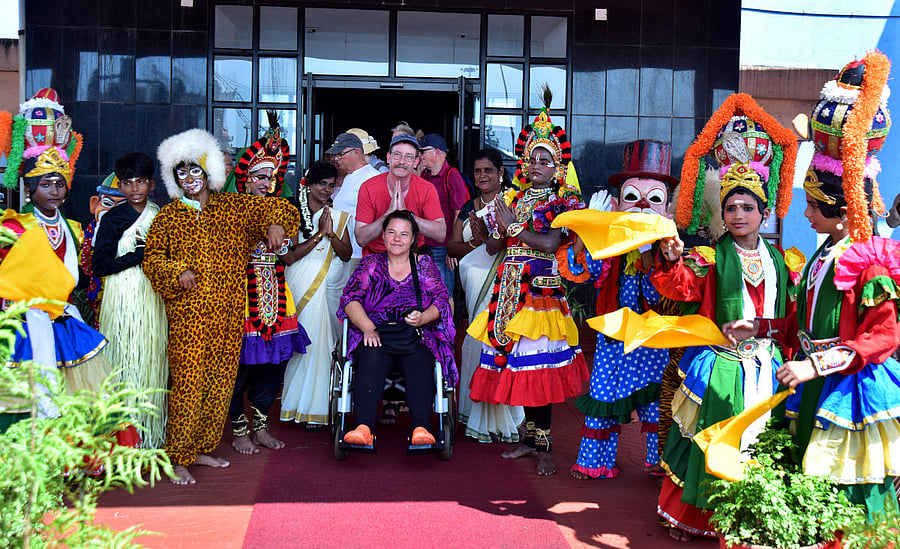 Passengers from cruise vessel Aida Vita being greeted by folk artistes, at cruise lounge of New Mangalore Port in Mangaluru on Monday. DH Photo