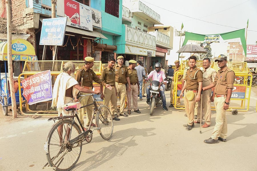 Police personnel conduct searches near the site of disputed Ram Janambhoomi-Babri Masjid site, as the verdict date nears, in Ayodhya, Friday, Nov. 8, 2019. (PTI Photo/ Nand Kumar)