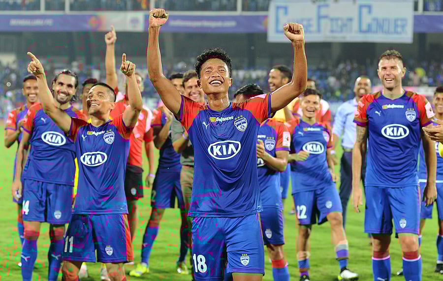 Bengaluru FC players celebrates after winning the match against Chennaiyan FC at Shree Kanteerva Stadium in Bengaluru. (DH Photo)