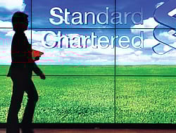 WORRIES SHROUD THE BANKING SECTOR: A staff member walks inside a priority banking service area of a Standard Chartered bank in Hong Kong. REUTERS