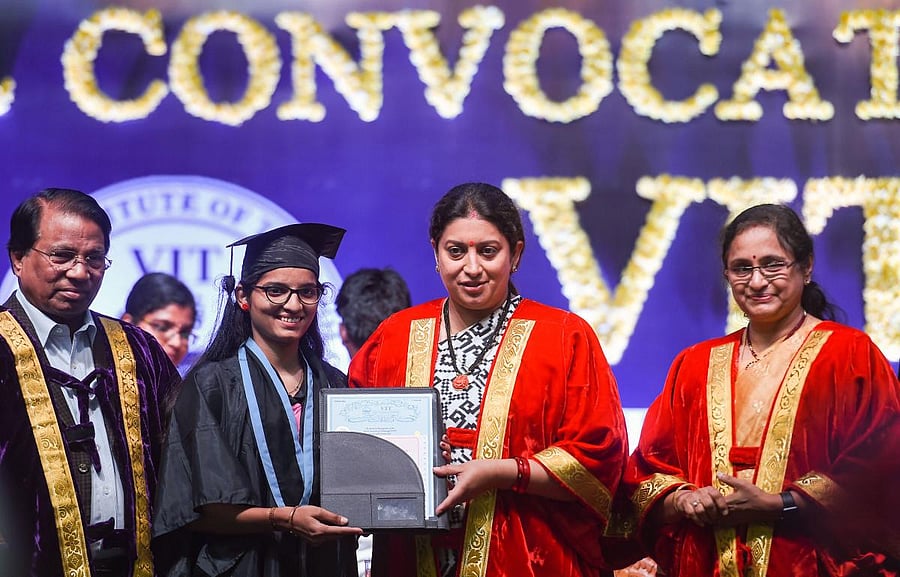 Union Minister for Women, Child Development and Textiles, Smriti Zubin Irani presents certificates to students during the annual convocation of Vellore Institute of Technology (VIT), on the outskirts of Chennai, Tuesday, Nov. 12, 2019. (PTI Photo)