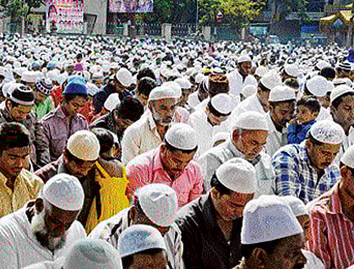 Muslims offer mass prayer on the occasion of Bakrid at Eidga Midan in Chamrajpet on Monday. dh photo
