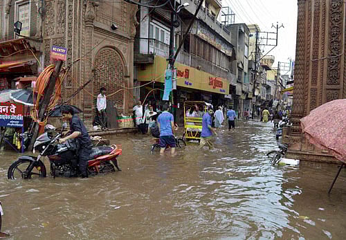 A flooded street after heavy rains in Mathura on Monday. PTI Photo