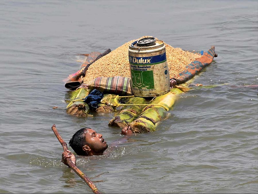 The toll in Bihar floods has risen to 56, with 69.81 lakh people being hit by inundation in 13 districts of the state. Photo credit: PTI.