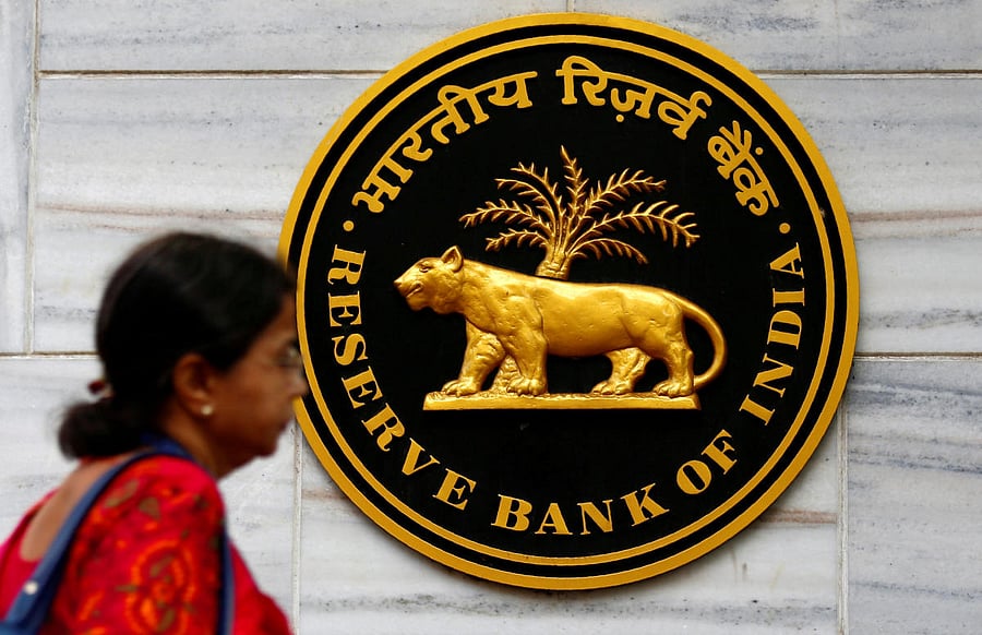 FILE PHOTO: A woman walks past the Reserve Bank of India (RBI) head office in Mumbai, India, December 6, 2017. REUTERS/Shailesh Andrade/File photo