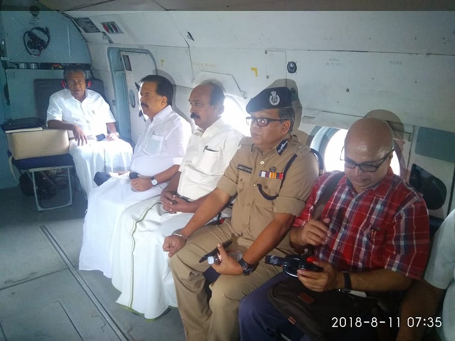 Chief Minister Pinarayi Vijayan, Opposition leader Ramesh Chennithala, Revenue Minister E Chandrasekharan and other conducting areal survey of flood-hit areas. Image: Facebook/Pinarayi Vijayan
