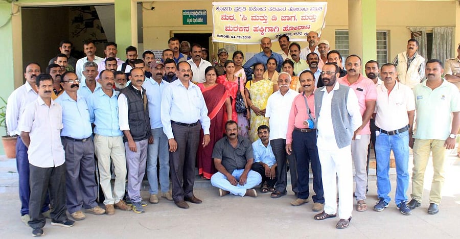 Members of the Prakruthi Vikopa Santrasthara Horata Samiti stage a protest in front of Aranya Bhavana in Madikeri on Monday.