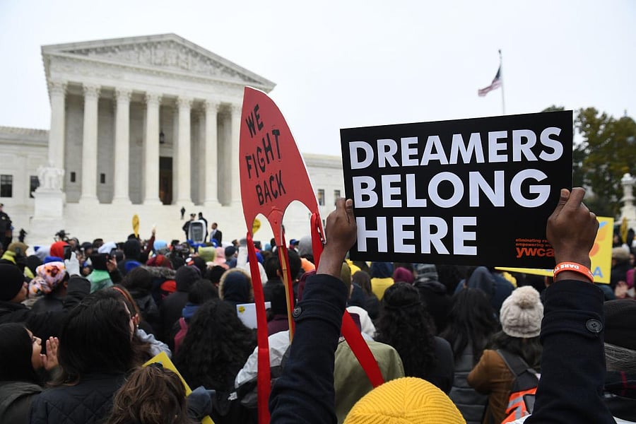 Immigration rights activists take part in a rally in front of the US Supreme Court in Washington (AFP)