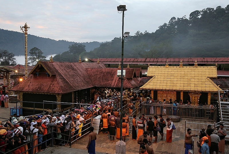 Hindu devotees wait in queues inside the premises of the Sabarimala temple. (Reuters Photo)