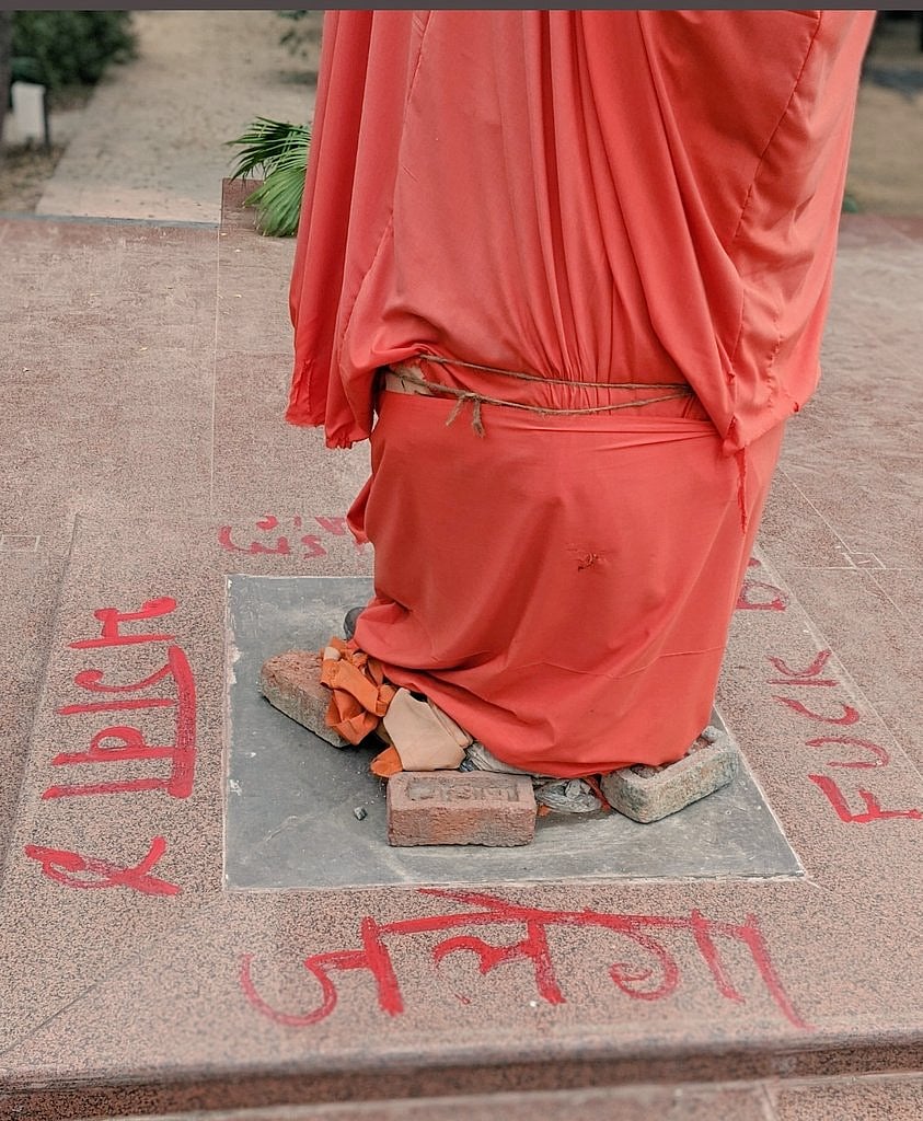 The statue, which is covered in a saffron-coloured cloth, is located at the varsity's administrative block, which is currently "occupied" by students protesting an increase in hostel fee. (Twitter Image/ @Mayank82340257)